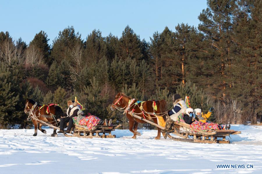 tourists go sleighing in beiji village of mohe city, ne china